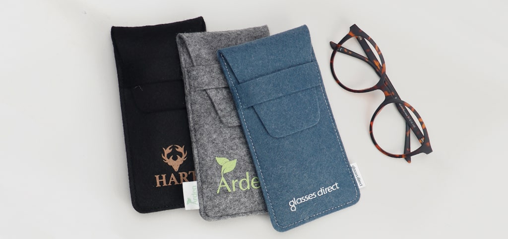 Sustainable, eco-friendly Hart, Arden and GD pouches with a pair of glasses next to them