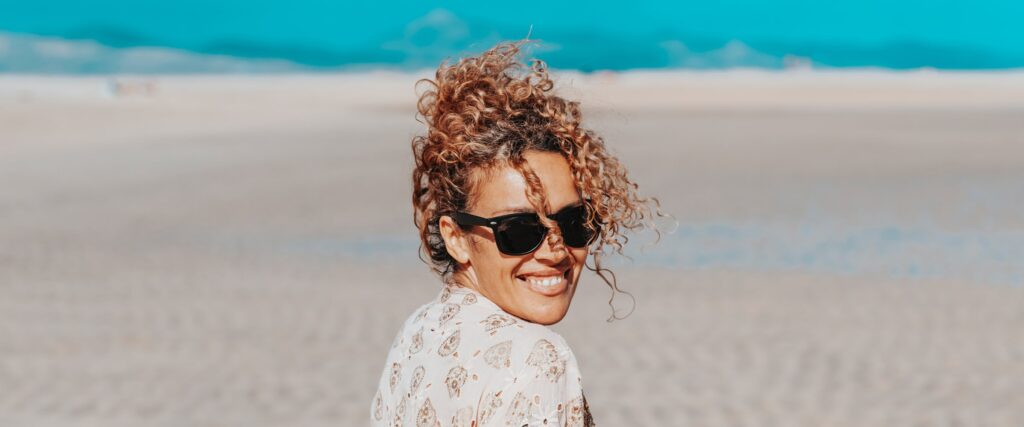 Woman wearing sunglasses on the beach