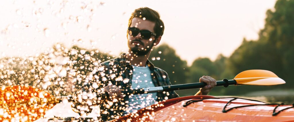 Man wearing sunglasses in a kayak