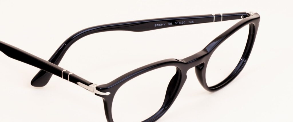 Square black Persol frame with right arm folded in angled facing to the right
