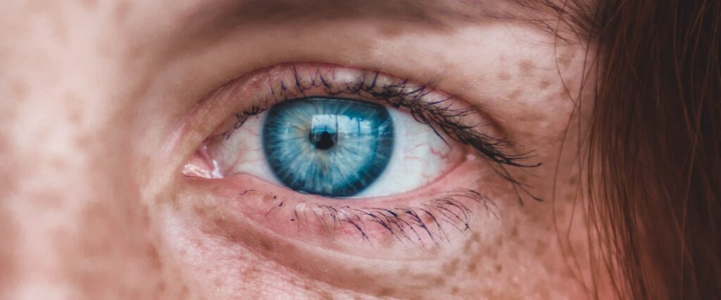 Close-up of a bright blue human eye