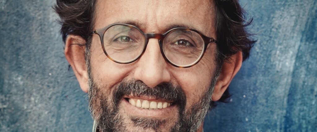 Older male with beard wearing round tortoisehell varifocal frames