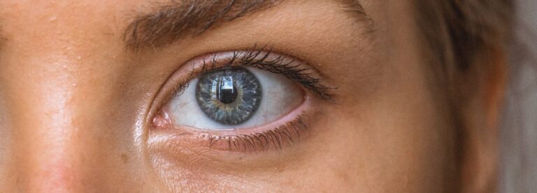 Close-up of woman's blue eye