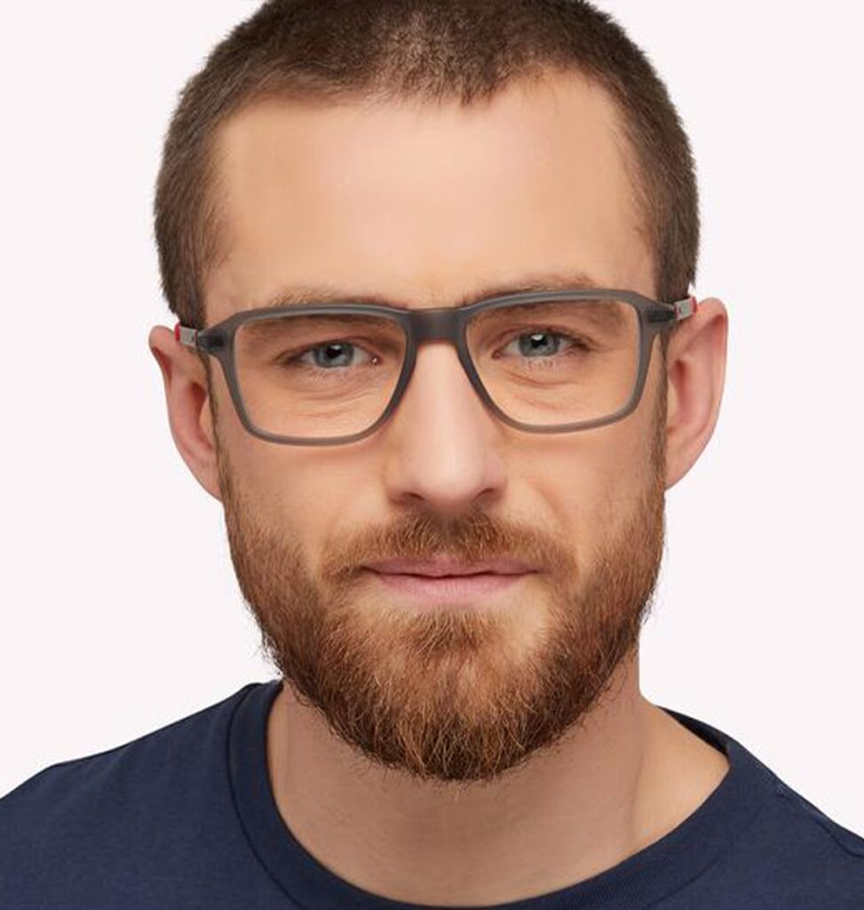 Man with beard wearing grey rectangular frames