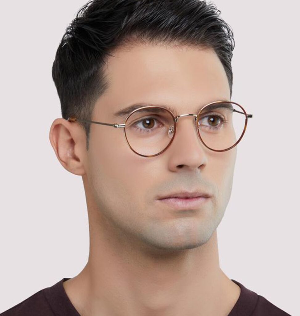 Man with a Great Gatsby hairstyle wearing gold round London Retro frames