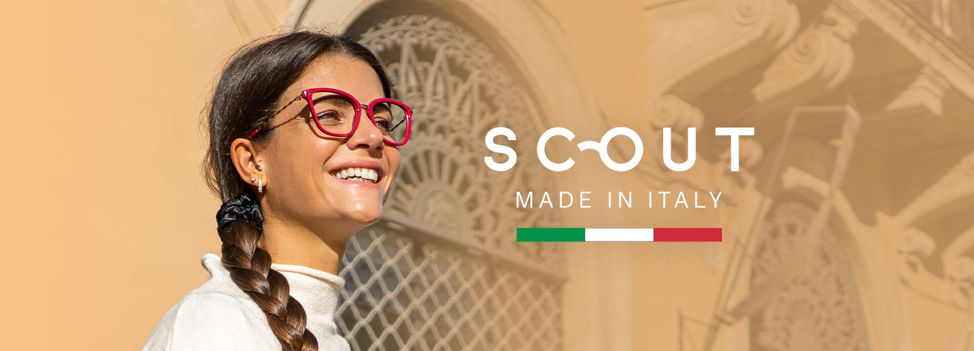 Woman wearing pink Scout Made in Italy frames outdoors smiling looking right