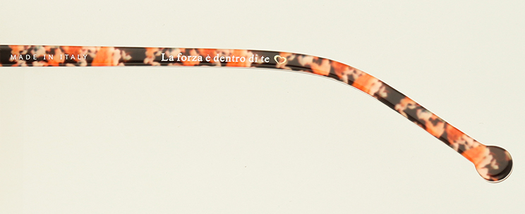 Close-up of Orange floral on inside arm showing inscription
