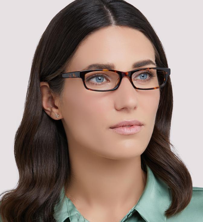 Woman with straight dark brown hair wearing Brazen-52 glasses