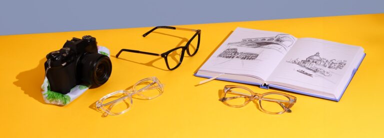 3 pairs of Scout: Made in Italy frames on a yellow background next to a camera and italian sketch